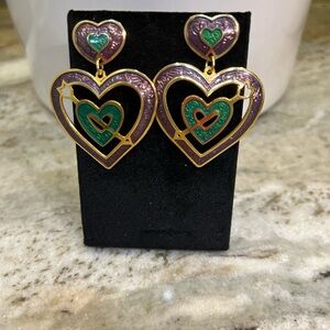 Perfect for any occasion. Gold tone, double heart drop post earrings.